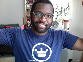 Baratunde Thurston wears a T Shirt with a logo on it